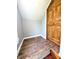 An attic room featuring hardwood floors and a wooden door at 3514 Carson Ave, Indianapolis, IN 46227