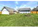 Spacious backyard featuring a fire pit and large grassy area, perfect for outdoor activities at 3514 Carson Ave, Indianapolis, IN 46227