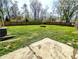 Spacious, well-maintained backyard featuring lush green grass, a sturdy wooden fence, and room for various outdoor activities at 3514 Carson Ave, Indianapolis, IN 46227