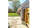 Back yard view of the house with fencing, concrete pad, and some greenery at 3514 Carson Ave, Indianapolis, IN 46227