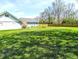 Large, well-kept backyard with lush grass and a wooden fence, providing privacy and ample space for outdoor recreation at 3514 Carson Ave, Indianapolis, IN 46227