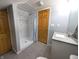 This remodeled bathroom features a walk-in shower with modern tile work and sleek fixtures at 3514 Carson Ave, Indianapolis, IN 46227