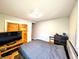 Cozy bedroom features a comfortable bed, wood floors, and wood closet doors at 3514 Carson Ave, Indianapolis, IN 46227