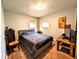Comfortable bedroom features a bed, wood floors, and natural light from the windows at 3514 Carson Ave, Indianapolis, IN 46227