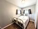 Bedroom with hardwood floors, a white metal bed frame, and neutral paint at 3514 Carson Ave, Indianapolis, IN 46227
