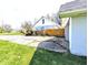 View of the back of the house showing fencing, driveway, and some greenery at 3514 Carson Ave, Indianapolis, IN 46227