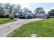 View of the exterior of a well-maintained house with a detached garage at 3514 Carson Ave, Indianapolis, IN 46227