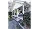 Inviting front porch with seating area and decorative hanging plants at 3514 Carson Ave, Indianapolis, IN 46227