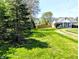 Charming home with a spacious front yard and mature trees, offers great curb appeal at 3514 Carson Ave, Indianapolis, IN 46227