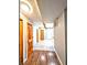 Hallway with wood and tile floors, connecting different areas of the home with an open flow at 3514 Carson Ave, Indianapolis, IN 46227