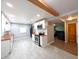 Bright kitchen with modern stainless-steel appliances, white cabinets and hardwood floors at 3514 Carson Ave, Indianapolis, IN 46227