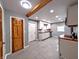 Open kitchen with white cabinets, wooden countertops, stainless appliances, and gray floor tiling at 3514 Carson Ave, Indianapolis, IN 46227