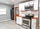 Modern kitchen featuring stainless steel appliances and butcher block countertops at 3514 Carson Ave, Indianapolis, IN 46227