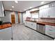 Updated kitchen with white cabinets, butcher block countertops, and stainless steel appliances at 3514 Carson Ave, Indianapolis, IN 46227