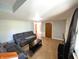 Spacious living room features wood flooring, two couches and natural light at 3514 Carson Ave, Indianapolis, IN 46227