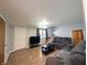 Cozy living room featuring hardwood floors, neutral walls, and access to the stairway at 3514 Carson Ave, Indianapolis, IN 46227