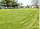 Expansive green lawn, perfect for outdoor activities, stretches across the property at 3514 Carson Ave, Indianapolis, IN 46227