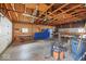 Spacious garage featuring exposed wooden beams, workbench, and ample storage space at 3737 Forest Ter, Anderson, IN 46013