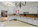 Bright kitchen with white cabinets, wood countertops, and ample storage, perfect for cooking and entertaining at 3737 Forest Ter, Anderson, IN 46013