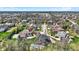Picturesque aerial view capturing a vibrant neighborhood with beautiful landscaping and tree-lined streets at 3940 Woodcrest Ct, Westfield, IN 46062