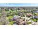 Scenic aerial view of a charming neighborhood with mature trees, manicured lawns, and winding streets at 3940 Woodcrest Ct, Westfield, IN 46062