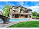 Lush backyard featuring a swimming pool with a slide, a fire pit, and covered patio, ideal for outdoor gatherings at 3940 Woodcrest Ct, Westfield, IN 46062