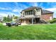 Expansive backyard featuring a pool, fire pit, and covered patio, ideal for outdoor enjoyment at 3940 Woodcrest Ct, Westfield, IN 46062