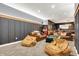 Finished basement boasts comfortable seating, including beanbag chairs and leather sofas at 3940 Woodcrest Ct, Westfield, IN 46062