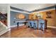 Finished basement with a built-in bar, wood accents, and pendant lighting at 3940 Woodcrest Ct, Westfield, IN 46062