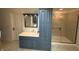 Bathroom with a blue vanity, a spacious glass shower, and neutral tile flooring at 3940 Woodcrest Ct, Westfield, IN 46062