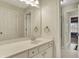 Bright bathroom with white vanity, ample storage, and a large mirror at 3940 Woodcrest Ct, Westfield, IN 46062