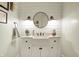 Charming powder room with shiplap walls, a farmhouse sink, and stylish lighting fixtures at 3940 Woodcrest Ct, Westfield, IN 46062