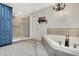 Bathroom featuring a bathtub, a walk-in shower, and neutral tile at 3940 Woodcrest Ct, Westfield, IN 46062