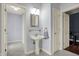 Bright bathroom featuring a pedestal sink, tile floors, and neutral colors at 3940 Woodcrest Ct, Westfield, IN 46062