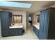 This bathroom features double sinks, plenty of cabinet storage, and a skylight at 3940 Woodcrest Ct, Westfield, IN 46062