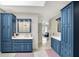 Elegant bathroom with dual vanities, custom cabinetry, and tile flooring at 3940 Woodcrest Ct, Westfield, IN 46062