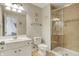 Bright bathroom featuring a glass shower, tiled floors, and ample lighting at 3940 Woodcrest Ct, Westfield, IN 46062