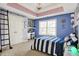 Spacious bedroom with large window, desk area, walk-in closet, and unique decor at 3940 Woodcrest Ct, Westfield, IN 46062