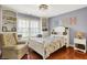 Charming bedroom features custom built-ins, hardwood floors, and colorful decor for a cozy feel at 3940 Woodcrest Ct, Westfield, IN 46062