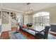 Elegant dining room with a large wood table, bench seating, and natural light at 3940 Woodcrest Ct, Westfield, IN 46062