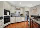 Well-appointed kitchen features granite counters, stainless steel appliances, and stone backsplash for a functional cooking space at 3940 Woodcrest Ct, Westfield, IN 46062
