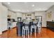Open-concept kitchen with granite counters and stainless-steel appliances features island seating for a modern, functional space at 3940 Woodcrest Ct, Westfield, IN 46062