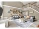Spacious living room with a staircase, plush seating, and a stylish area rug at 3940 Woodcrest Ct, Westfield, IN 46062