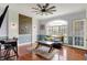 Charming living area with hardwood floors, large window and stylish decor offers a cozy and inviting space at 3940 Woodcrest Ct, Westfield, IN 46062