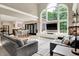 Bright living room featuring a large window, hardwood floors, and stylish furnishings at 3940 Woodcrest Ct, Westfield, IN 46062