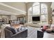 Bright living room with a vaulted ceiling and an open floor plan creates a seamless transition to the dining area at 3940 Woodcrest Ct, Westfield, IN 46062