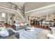 Open-concept living room with a staircase, modern decor, and hardwood flooring at 3940 Woodcrest Ct, Westfield, IN 46062