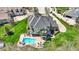 Gorgeous home boasts an inground pool, deck, and outdoor living spaces, perfect for entertaining at 3940 Woodcrest Ct, Westfield, IN 46062