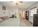 Spacious bedroom featuring a ceiling fan, large closet, and access to bathroom and bedroom at 4203 Main St, Anderson, IN 46013