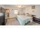 Cozy bedroom with neutral walls, carpet floors, ceiling fan, and stylish decor at 4203 Main St, Anderson, IN 46013